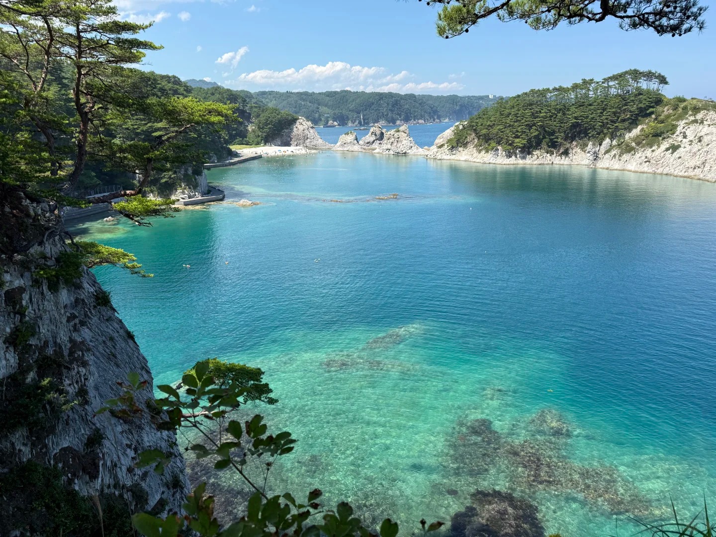 White rock pillars and blue water at Jodogahama beach in Iwate