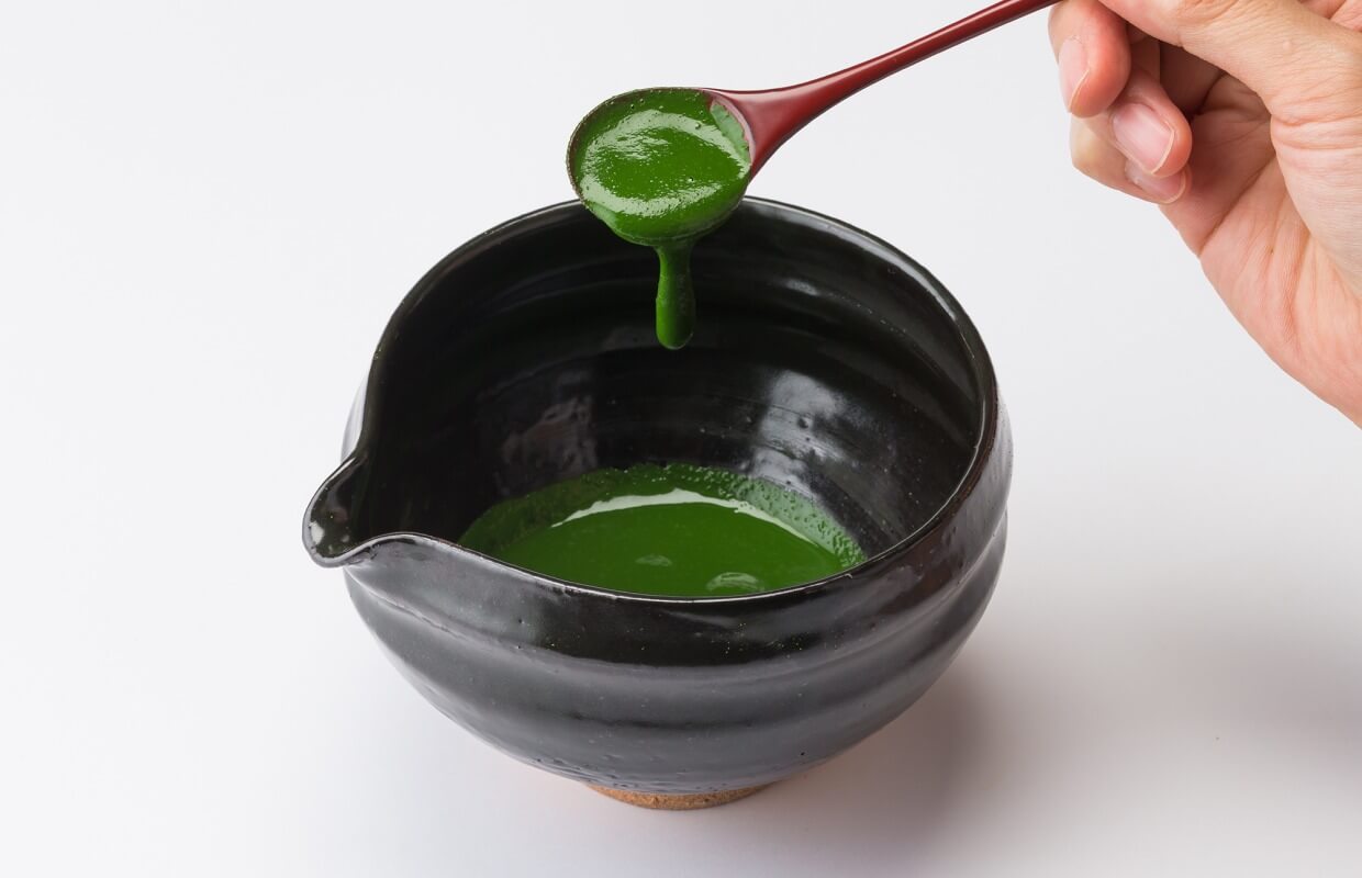 Koicha, thick and concentrated matcha paste in a tea bowl