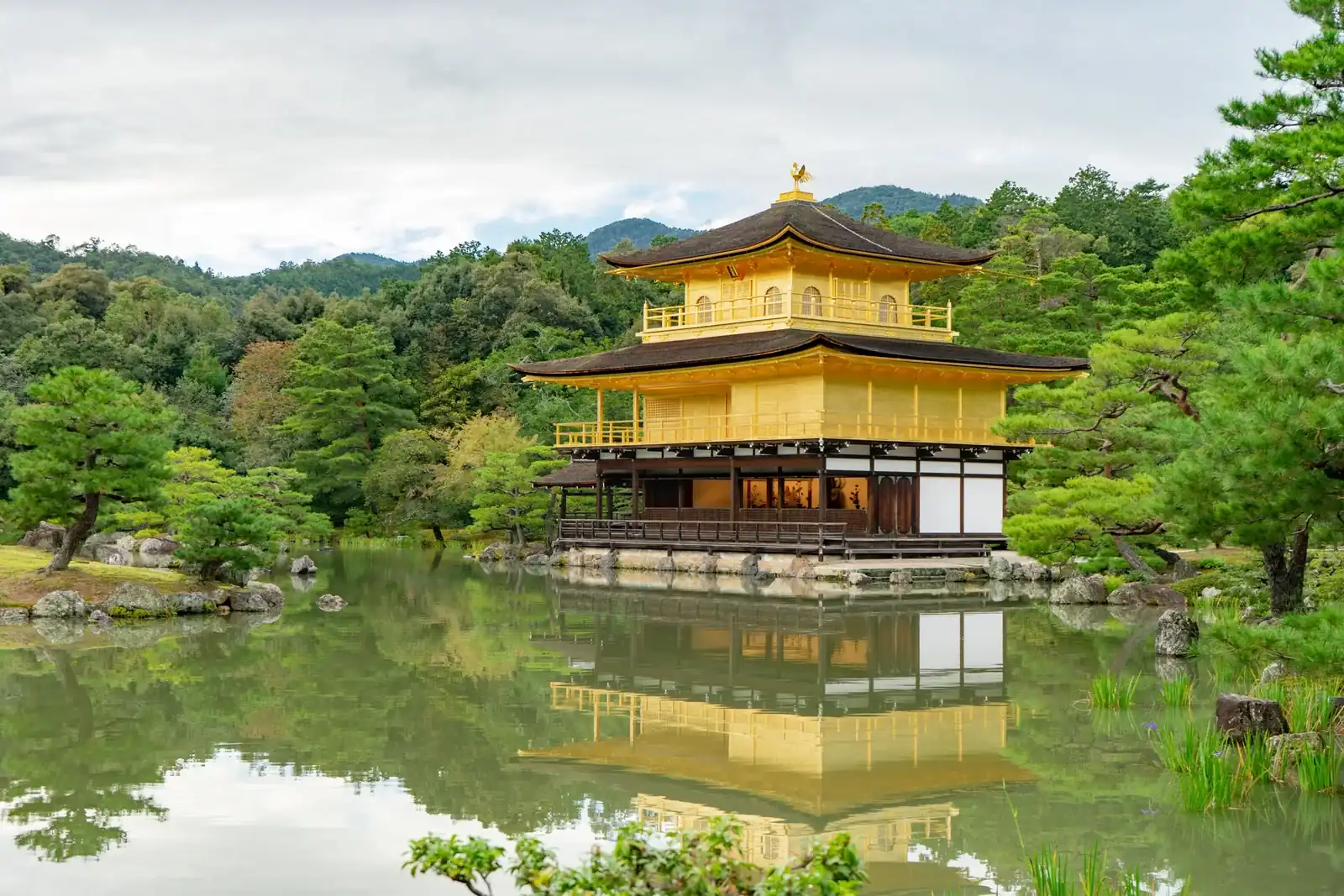 Golden temple in Kyoto reflected in a still pond