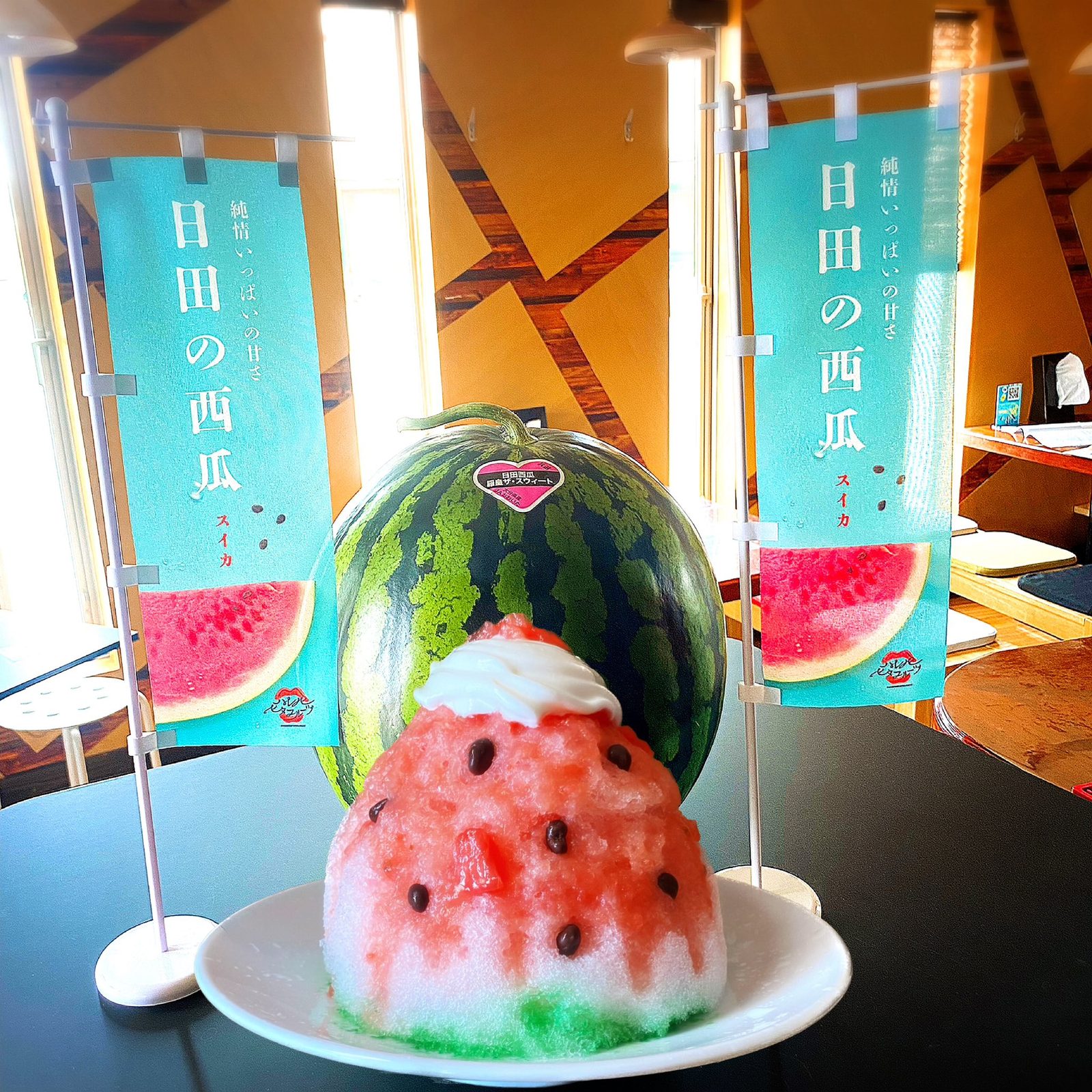 Hita watermelon kakigori served beside a whole watermelon